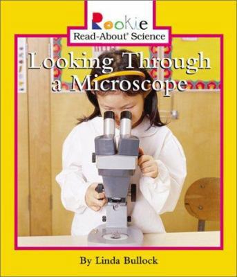 Looking Through a Microscope 0516228722 Book Cover