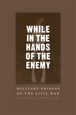 While in the Hands of the Enemy: Military Priso... 0807130613 Book Cover