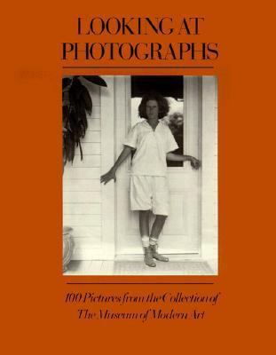 Looking at Photographs: 100 Pictures from the C... 0821226231 Book Cover