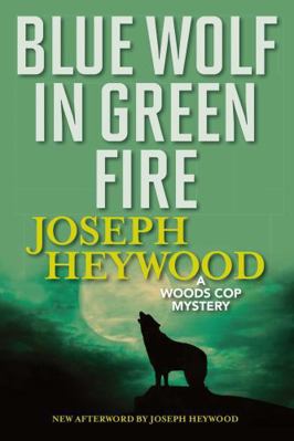 Blue Wolf in Green Fire: A Woods Cop Mystery 1493040499 Book Cover