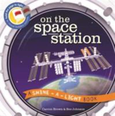 On the Space Station: A Shine-a-Light Book 1782404791 Book Cover