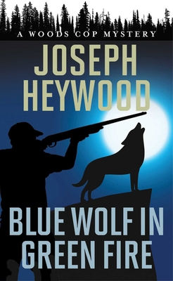 Blue Wolf in Green Fire: A Woods Cop Mystery 1493059149 Book Cover