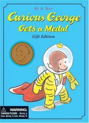 Curious George Gets a Medal: Gift Edition [With... 0618549064 Book Cover