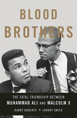 Blood Brothers: The Fatal Friendship Between Mu... 0465079709 Book Cover