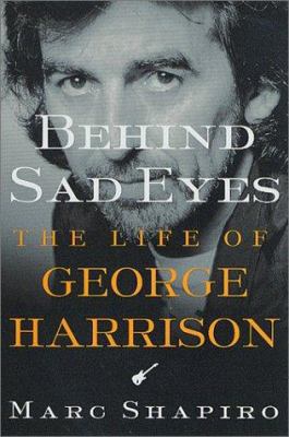Behind Sad Eyes: The Life of George Harrison 031230109X Book Cover