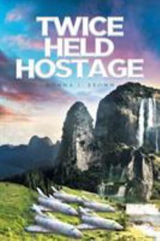 Paperback Twice Held Hostage Book