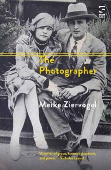 Paperback The Photographer Book