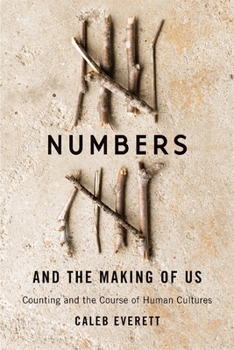 Paperback Numbers and the Making of Us: Counting and the Course of Human Cultures Book