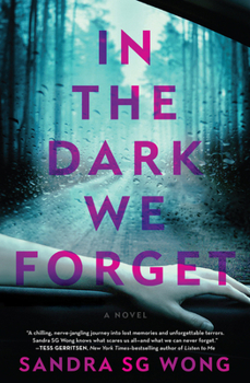 Paperback In the Dark We Forget Book