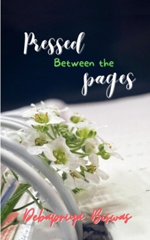 Paperback Pressed Between The Pages Book