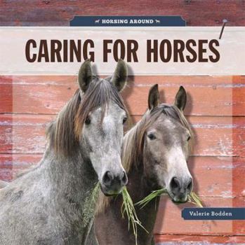 Paperback Caring for Horses Book
