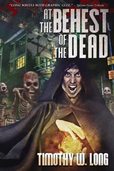 Paperback At the Behest of the Dead Book