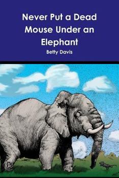 Paperback Never Put a Dead Mouse Under an Elephant Book