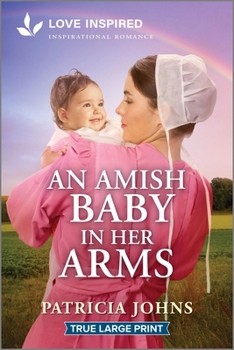 Paperback An Amish Baby in Her Arms [Large Print] Book