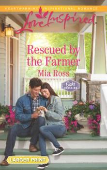 Mass Market Paperback Rescued by the Farmer [Large Print] Book