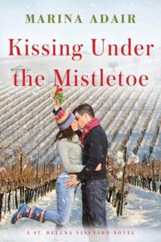 Paperback Kissing Under the Mistletoe Book