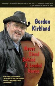 Paperback Never Stand Behind a Loaded Horse Book
