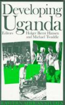 Paperback Developing Uganda Book