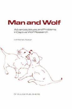 Hardcover Man and Wolf: Advances, Issues, and Problems in Captive Wolf Research Book
