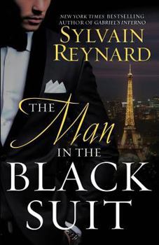Paperback The Man in the Black Suit Book