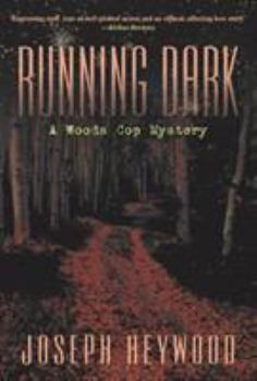 Paperback Running Dark: A Woods Cop Mystery Book