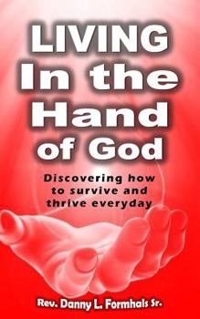 Paperback Living in the Hand of God Book