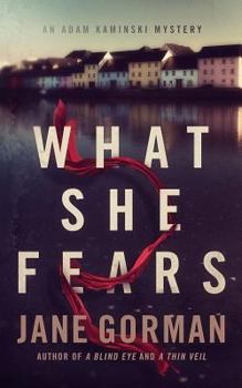 Paperback What She Fears: Book 4 in the Adam Kaminski Mystery Series Book