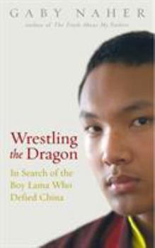 Paperback Wrestling the Dragon: In Search of the Boy Lama Who Defied China Book