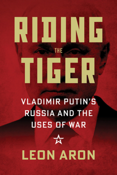 Paperback Riding the Tiger: Vladimir Putin's Russia and the Uses of War Book