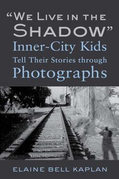 Paperback We Live in the Shadow: Inner-City Kids Tell Their Stories Through Photographs Book