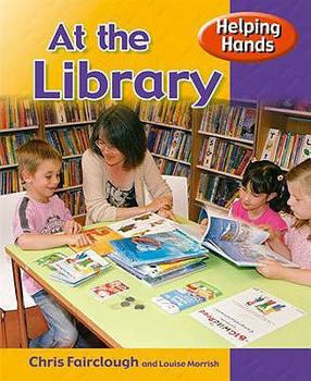 Paperback Helping Hands: At the Library Book