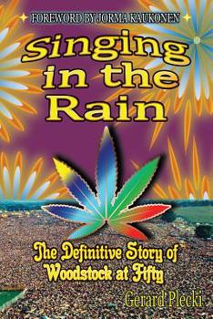 Paperback Singing in the Rain: The Definitive Story of Woodstock at Fifty Book