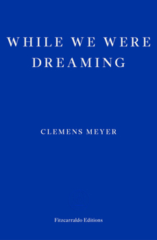 Paperback While We Were Dreaming Book