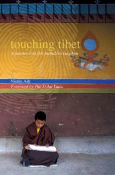 Paperback Touching Tibet Book