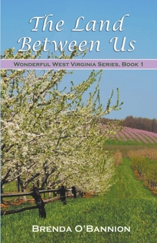 Paperback The Land Between Us Book