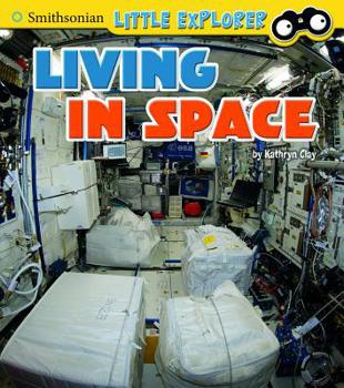 Paperback Living in Space Book