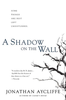 Paperback A Shadow on the Wall Book