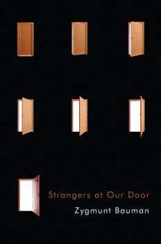 Paperback Strangers at Our Door Book