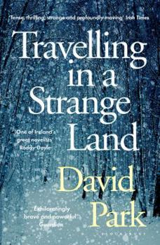Paperback Travelling in a Strange Land Book