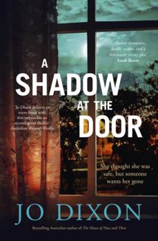 Paperback A Shadow at the Door Book