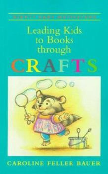 Paperback Leading Kids to Books Through Crafts Book