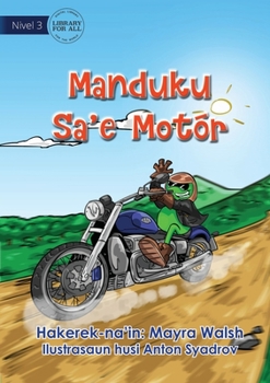 Paperback Frog Rides A Motorcycle - Manduku Sa'e Motór [Tetum] Book
