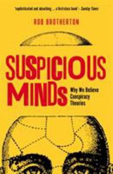 Paperback Suspicious Minds: Why We Believe Conspiracy Theories Book