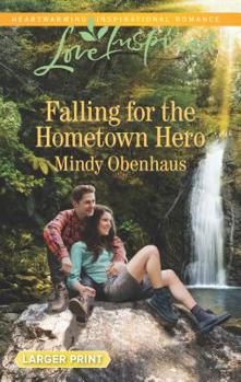 Mass Market Paperback Falling for the Hometown Hero [Large Print] Book