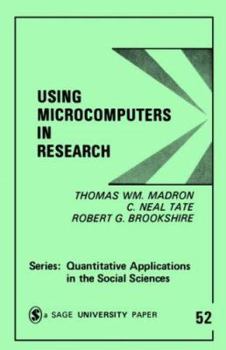 Paperback Using Microcomputers in Research Book