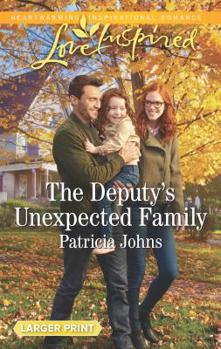 Mass Market Paperback The Deputy's Unexpected Family [Large Print] Book