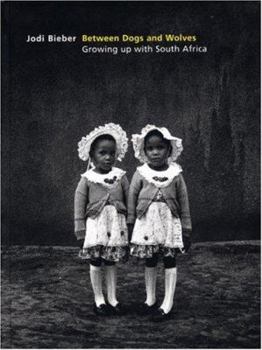 Hardcover Between Dogs And Wolves: Growing Up With South Africa Book