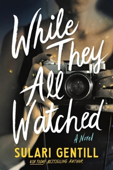 Paperback While They All Watched Book