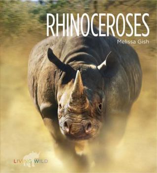 Paperback Living Wild: Rhinoceroses Book