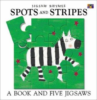 Board book Spots and Stripes [With 5 Puzzles Inside Book] Book